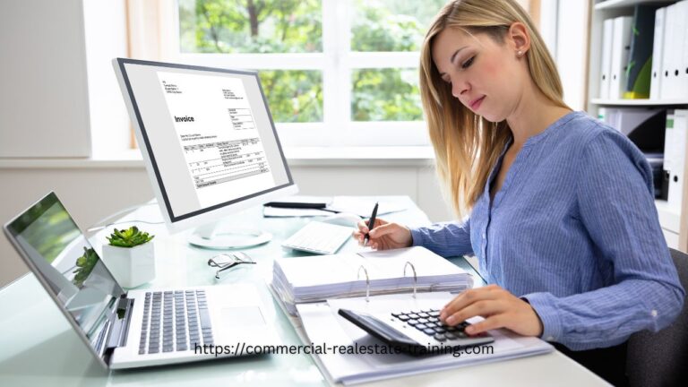 woman using calculator on desk