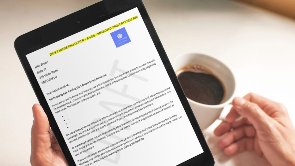 direct mail marketing letter on ipad screen, held by man having coffee