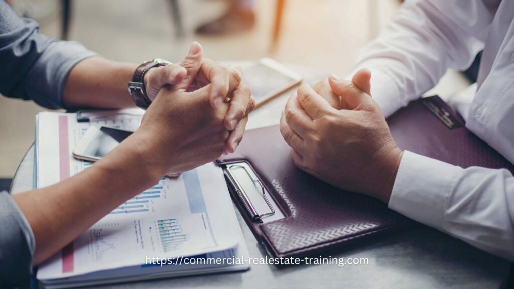 two people talking at table and negotiating