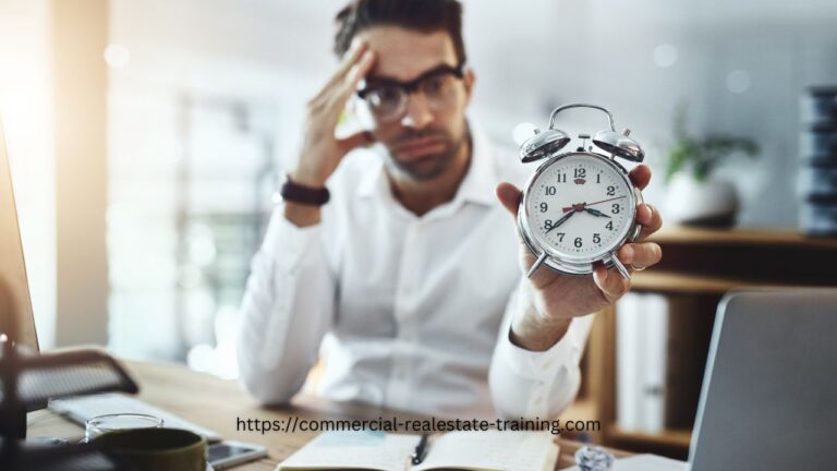 man holding clock and watching time